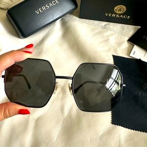 Original Versace glasses are like new, scratch-free, black with gold.